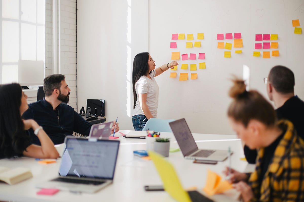 happy people gathered around a meeting table