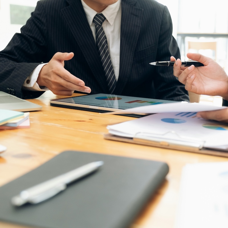 Local council advisors talking at a desk